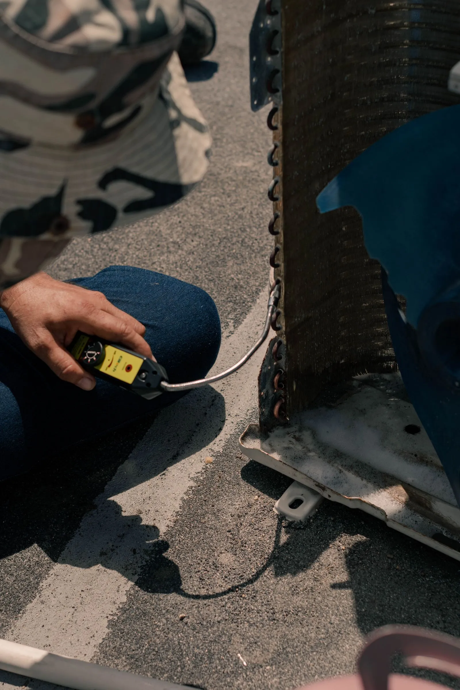 AC Repair Cave Creek AZ — close up of a technician working on an air conditioning unit