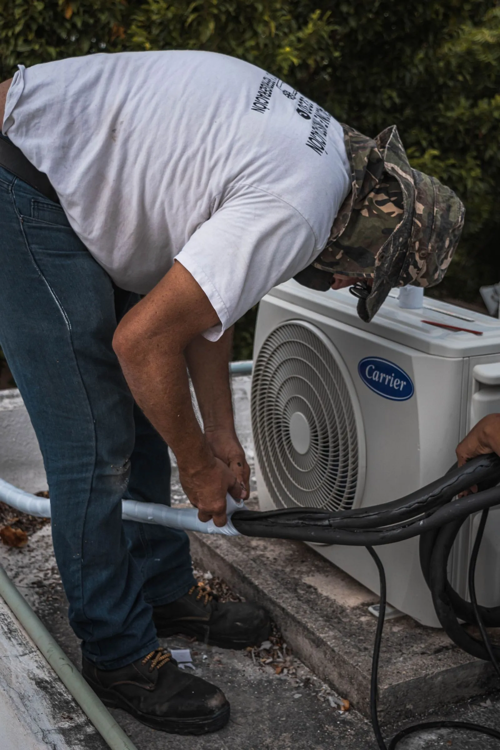 Residential AC Repair Cave Creek AZ — technician performing maintenance on a home condenser unit